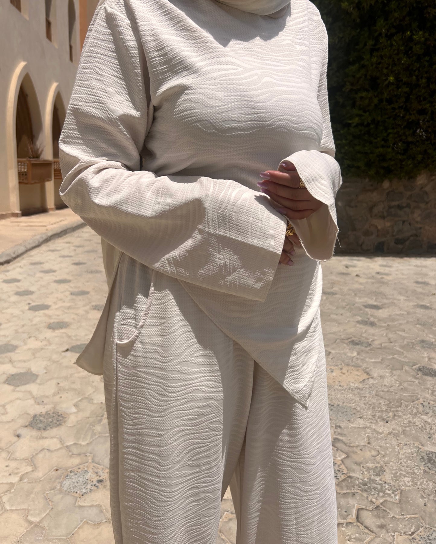 Off-white blouse with a wave pattern