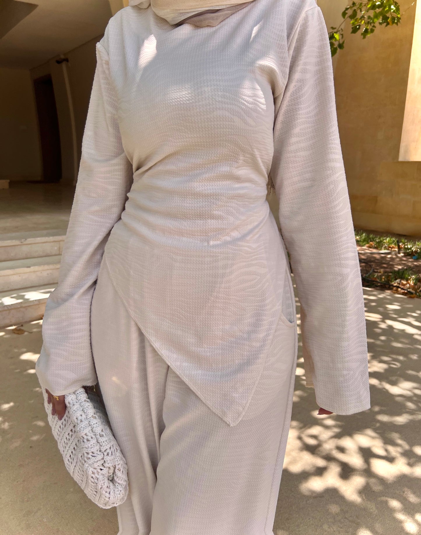 Off-white blouse with a wave pattern